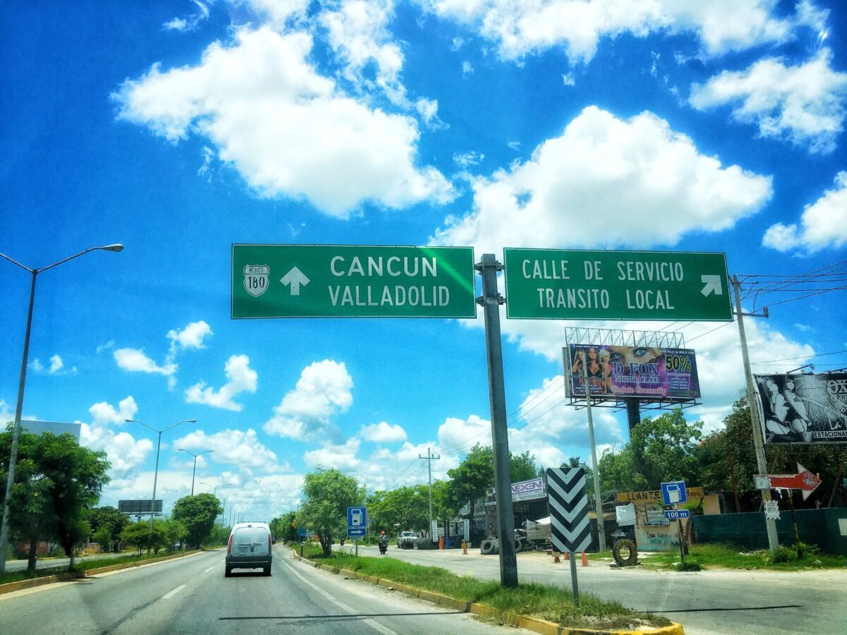 Highway 180 road sign from Mérida pointing toward Cancún and Valladolid, Yucatán