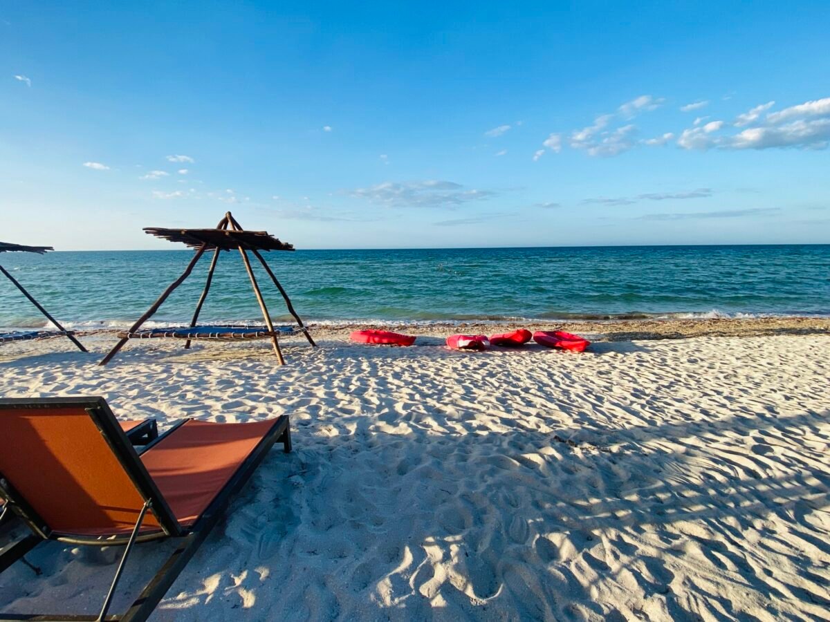 Beach chair and rustic palapa on a quiet Gulf Coast beach near Mérida, Yucatán, Mexico