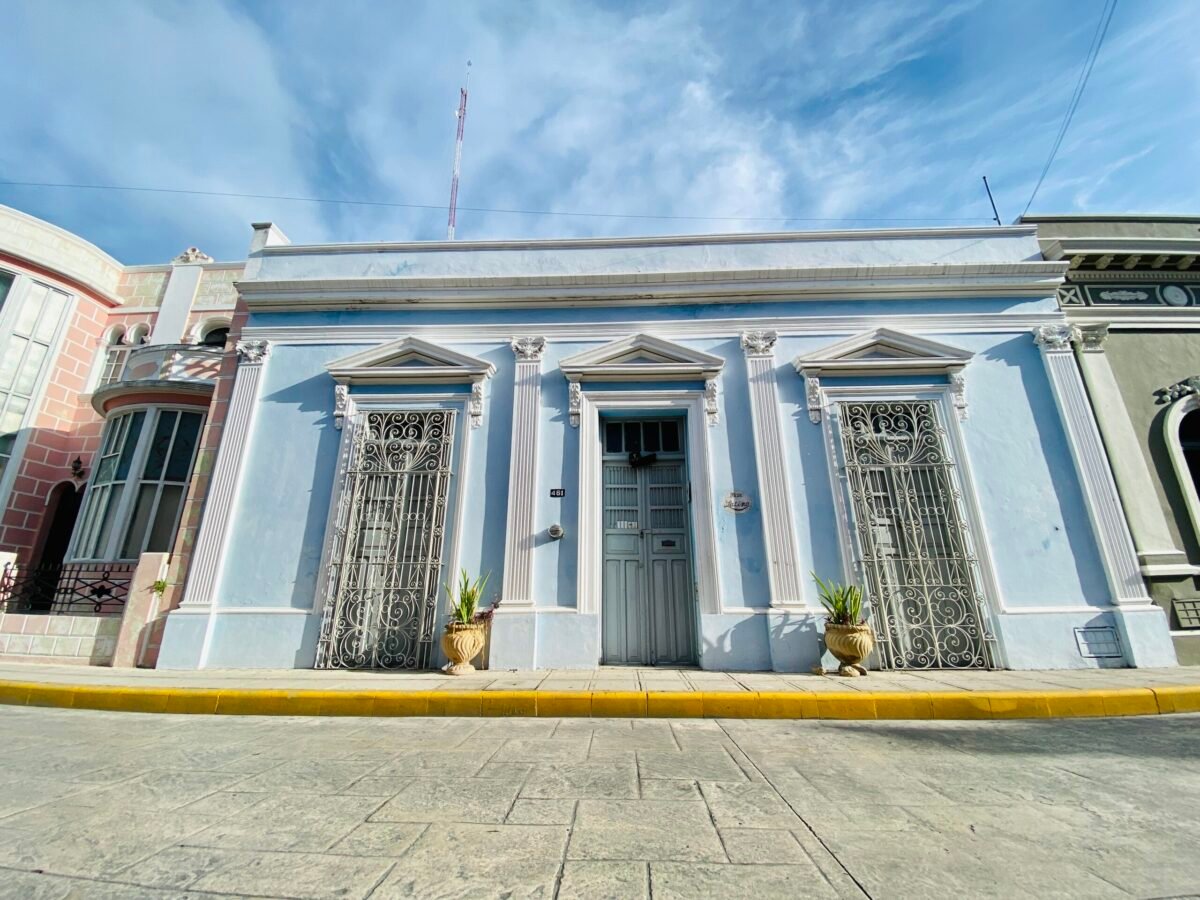 Light blue colonial house with white trim in Centro Merida Mexico