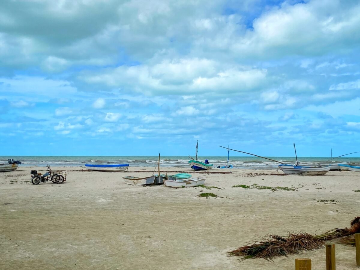 Local fishing boats pulled onto a windy Gulf Coast beach near Mérida, Yucatán, Mexico