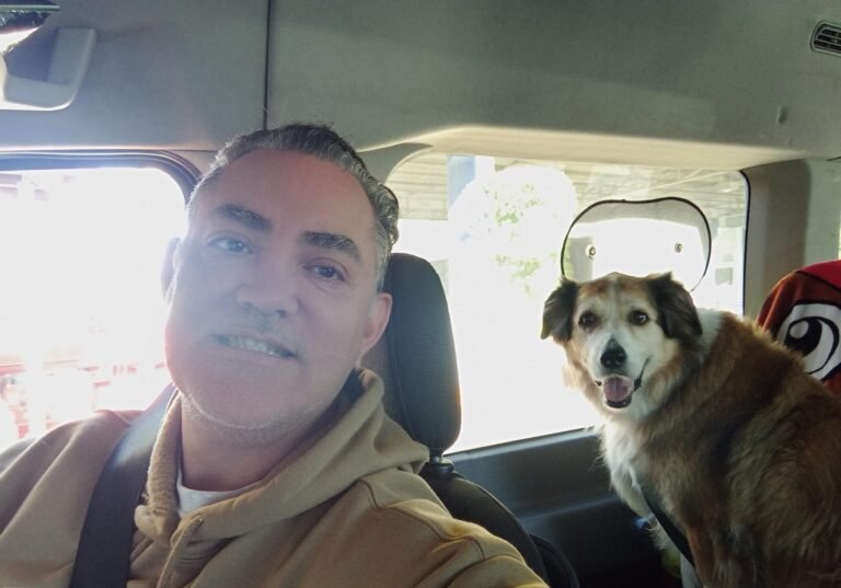 Alfonso Galindo owner of Best Mexico Pet Movers with a dog