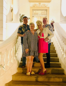 Angel Rodriguez and Amy Jones with clients on the grand staircase at Yerba Santa restaurant in Mérida, Yucatán — an evening out during a Life in Mérida™ research tour