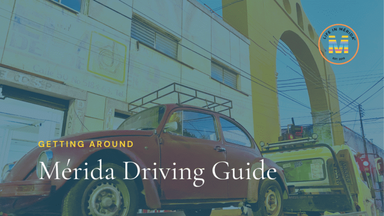 Merida Driving Guide image with red volkswagon beetle on a tow truck underneath a yellow arch